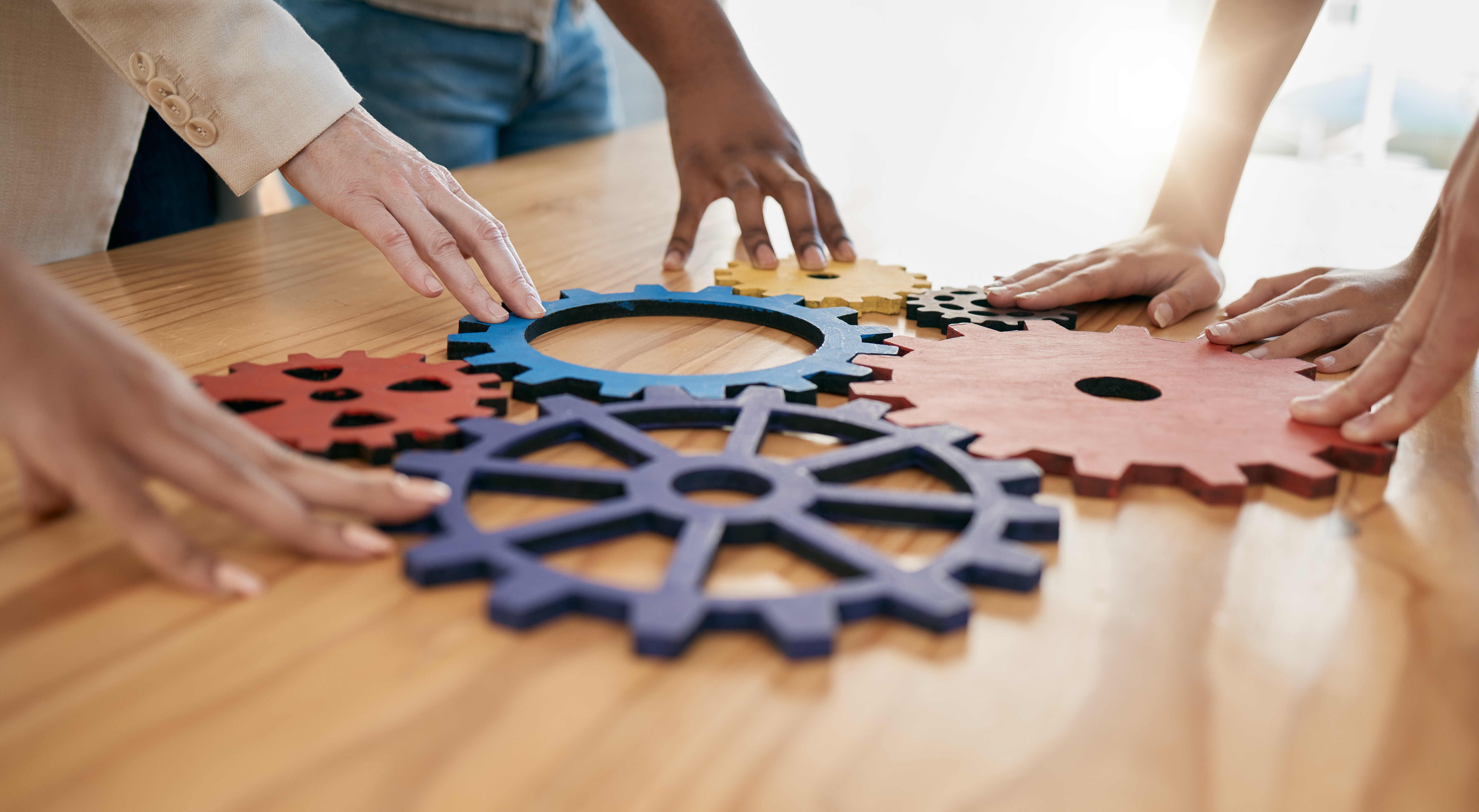 Colorful gears showing teamwork and collaboration